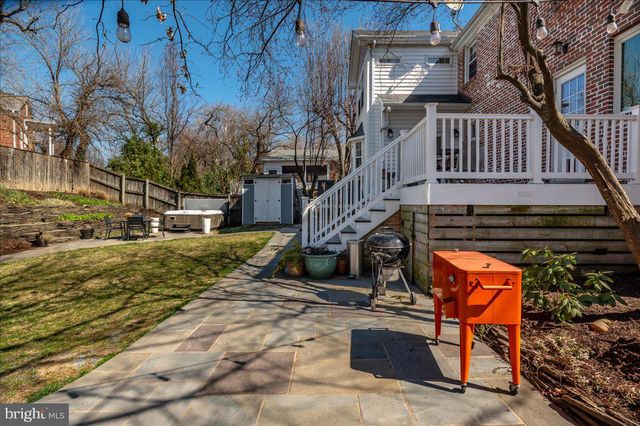 a stove top oven sitting inside of a kitchen