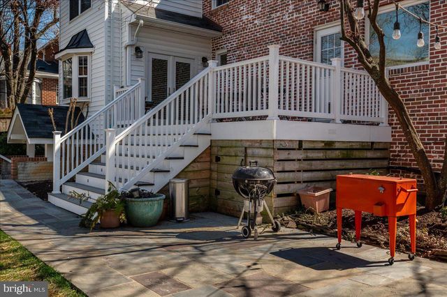 a view of a backyard with sitting area