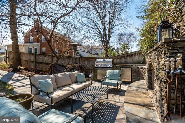 a view of a house with a chairs in patio