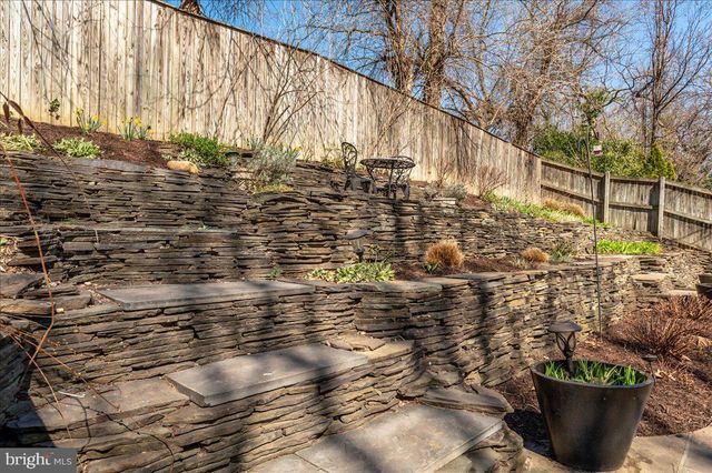 a living room with furniture and a dining table