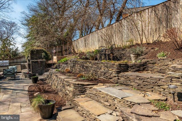 a view of a kitchen with dining table and chairs