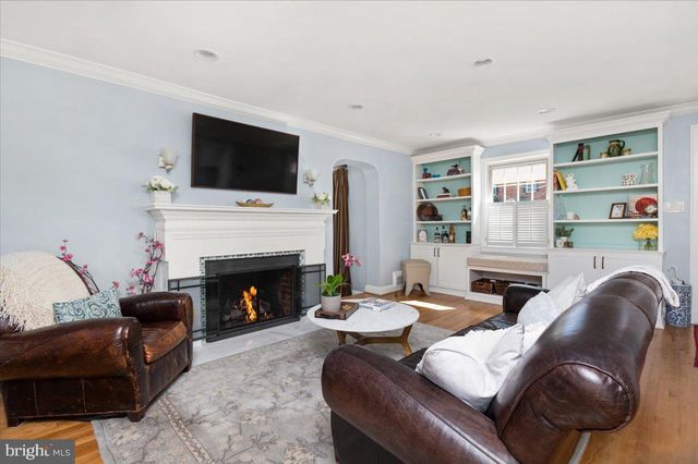 a view of a workspace with furniture and natural light