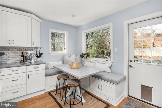 a room with a stove and a table