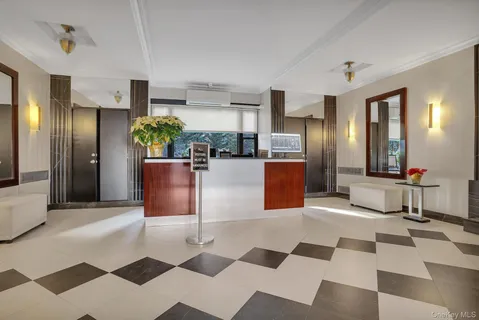 a kitchen with stainless steel appliances kitchen island granite countertop a refrigerator and microwave