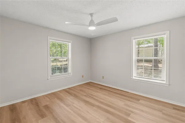 a view of an empty room with a window