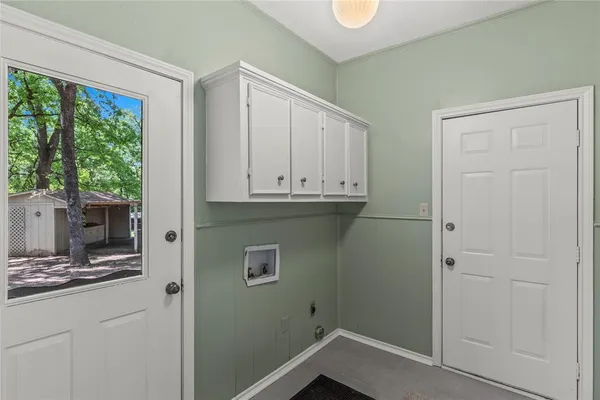 a room with a sink and cabinets