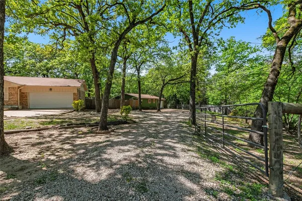 a backyard of a house with lots of green space