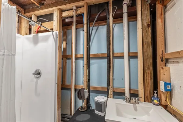 a bathroom with a tub and shower