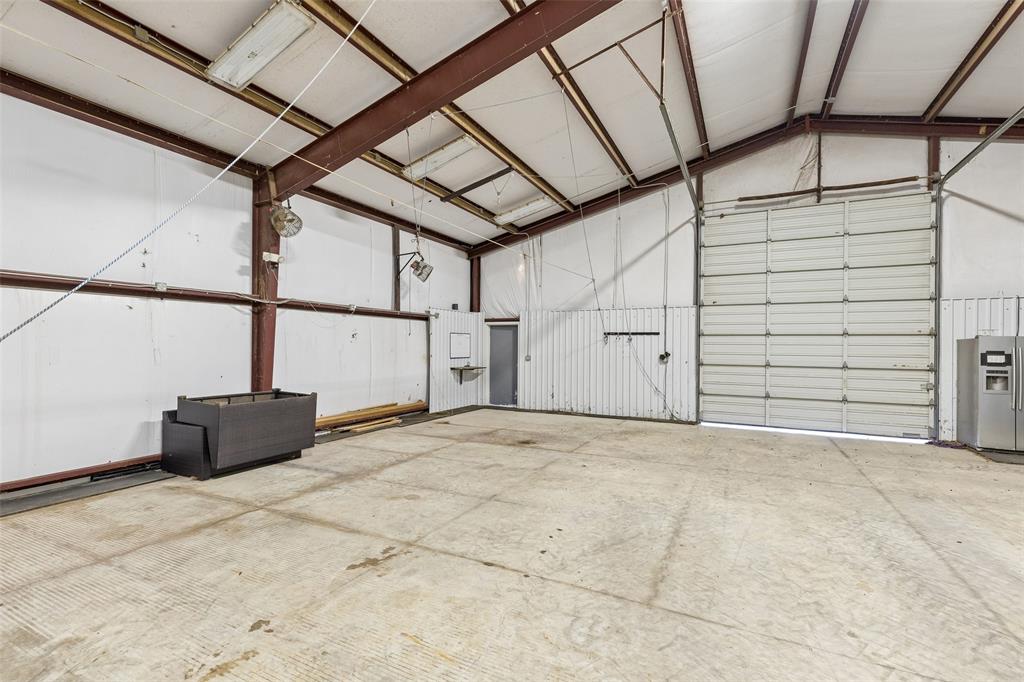 12630 Merrill Road Pilot Point, TX 76258 - Photo 32 of 39 Insulated red iron shop with office area or 1 bedroom apartment.