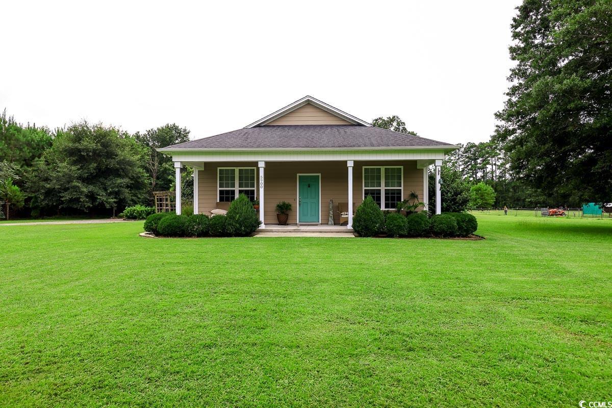 5900 Pope Martin Road Conway, SC 29527 - Photo 1 of 31 View of front of property with a porch and a front yard