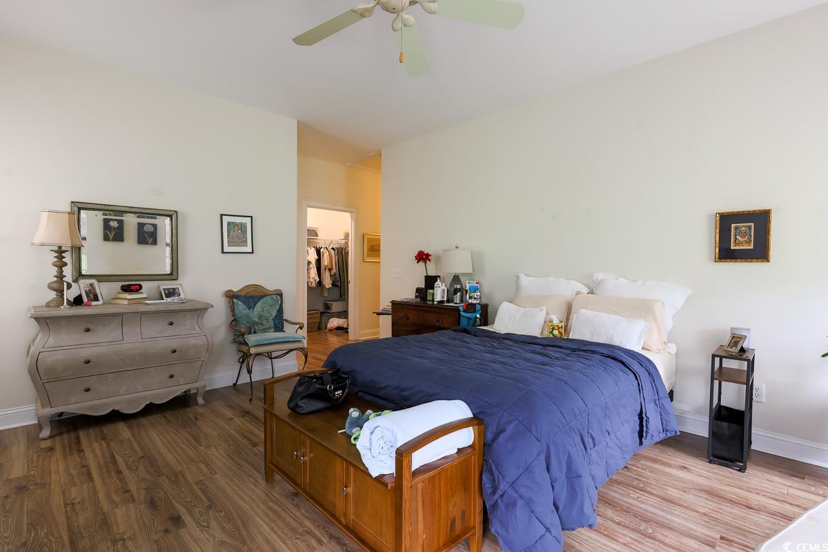5900 Pope Martin Road Conway, SC 29527 - Photo 11 of 31 Bedroom with wood finished floors, a spacious closet, and a ceiling fan