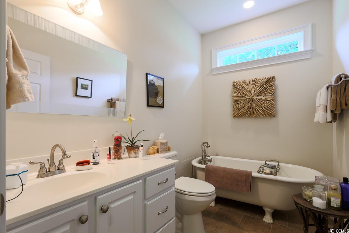 5900 Pope Martin Road Conway, SC 29527 - Photo 20 of 31 Bathroom featuring a freestanding bath, vanity, and tile patterned flooring