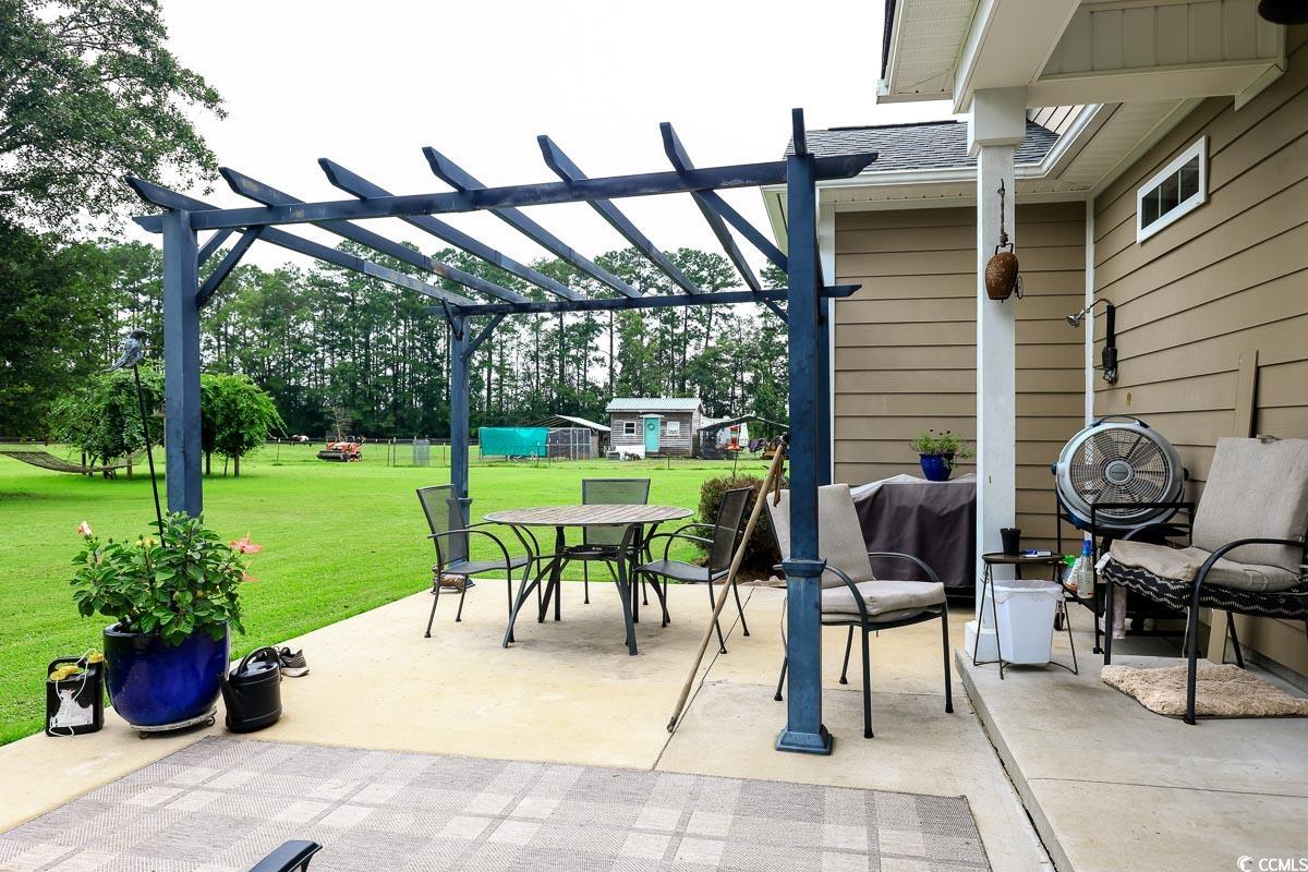 5900 Pope Martin Road Conway, SC 29527 - Photo 24 of 31 View of patio featuring outdoor dining area and a pergola