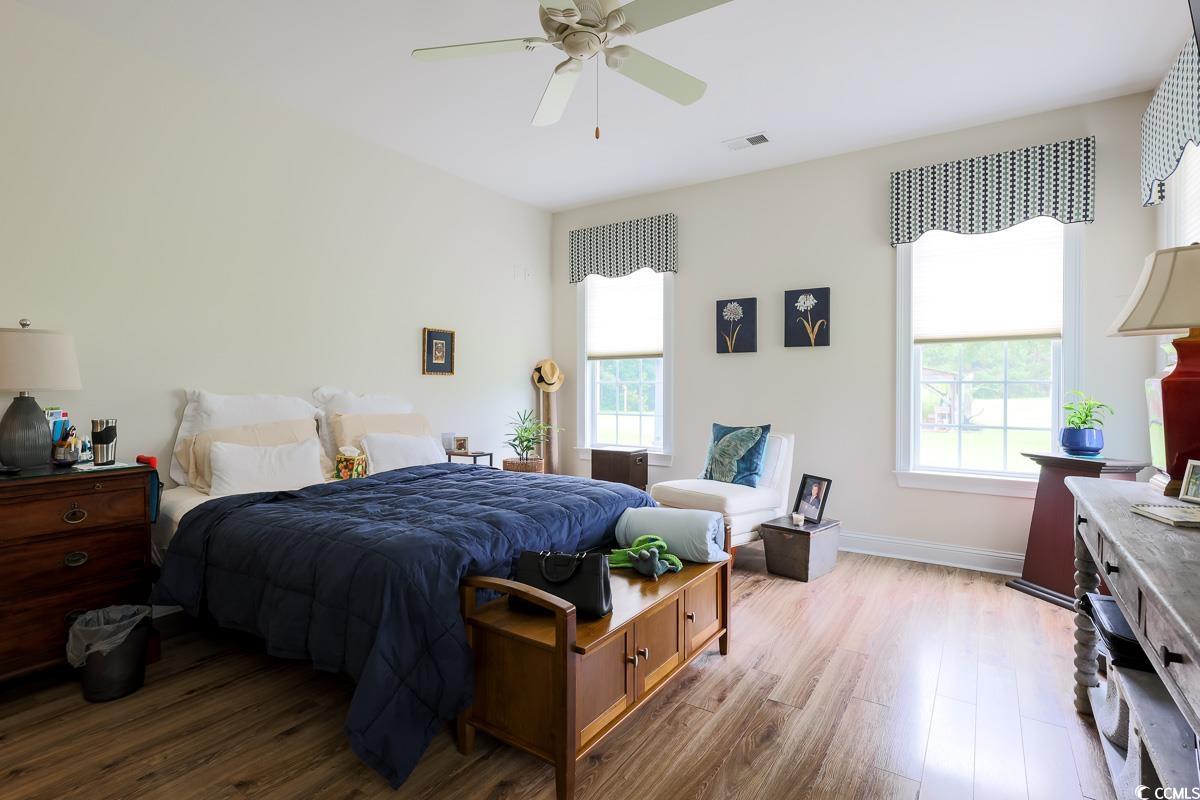 5900 Pope Martin Road Conway, SC 29527 - Photo 10 of 31 Bedroom featuring wood finished floors and a ceiling fan