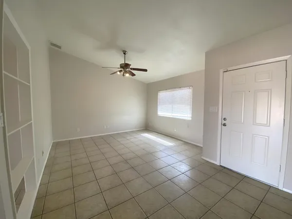 a view of an empty room and window