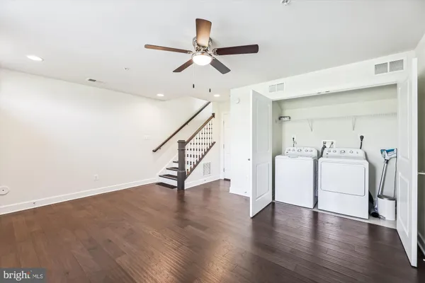 a view of an entryway with wooden floor