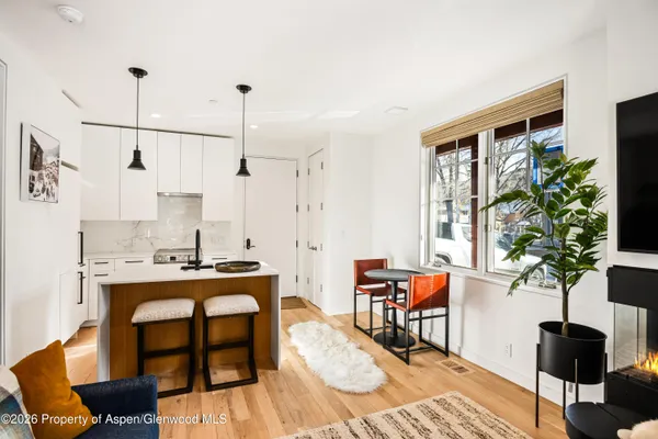 a work room with furniture and potted plants