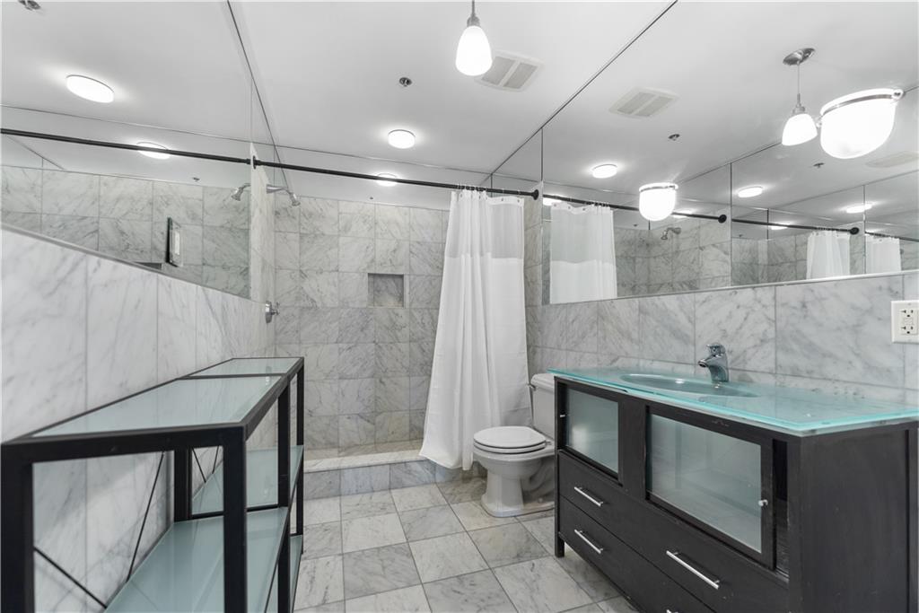3501 Butler Street, Unit 2A Pittsburgh, PA 15201 - Photo 16 of 22 Updated bathroom with marble tile