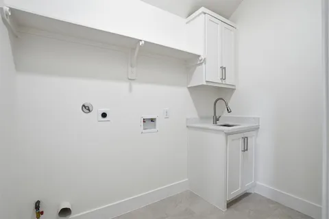 a bathroom with a sink and cabinets