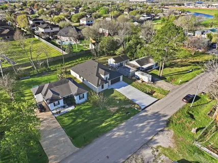 an aerial view of a house with a garden