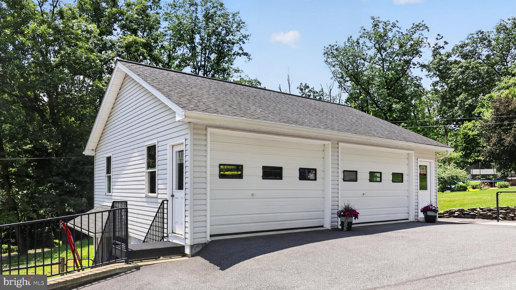 257 Hill Road New Holland, PA 17557 - Photo 47 of 94 Charming garage with scenic backdrop.