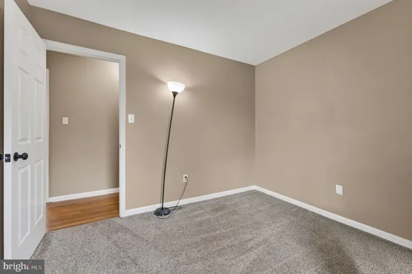 an empty room with closet area