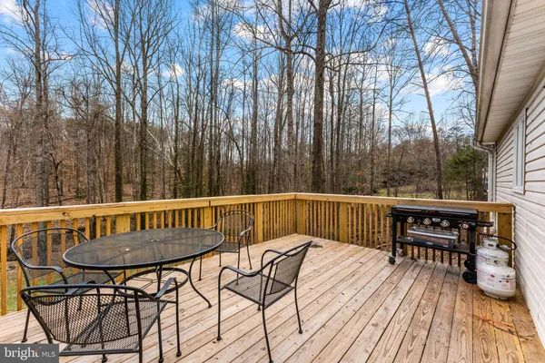 a view of a chairs and table on the deck