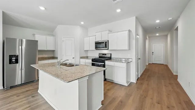a view of kitchen with wooden floor