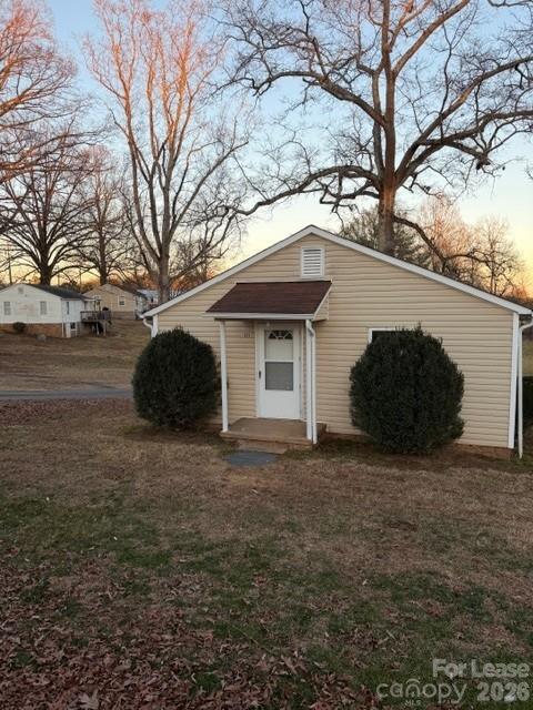 a view of a house with a large tree