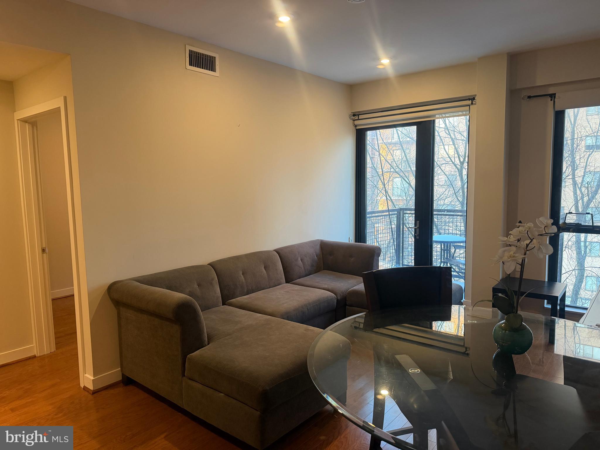 1320 Fenwick Lane, Unit 700 Silver Spring, MD 20910 - Photo 16 of 26 a living room with furniture and a window