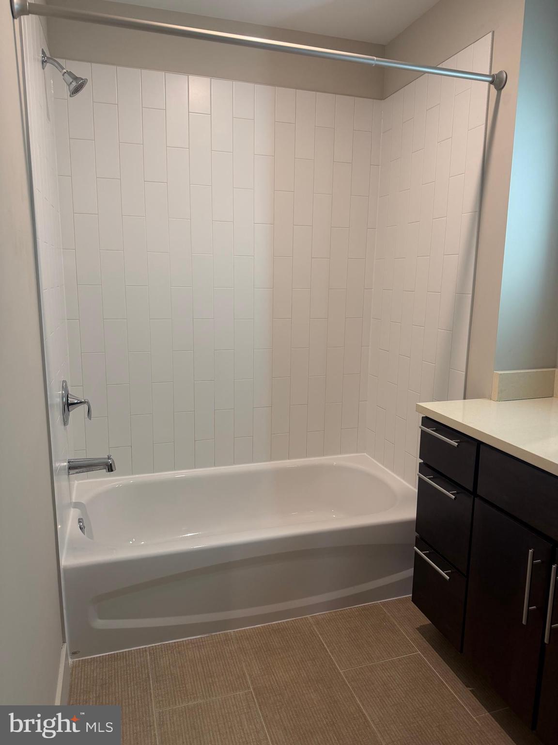 1320 Fenwick Lane, Unit 700 Silver Spring, MD 20910 - Photo 21 of 26 a bathroom with a bathtub and a shower