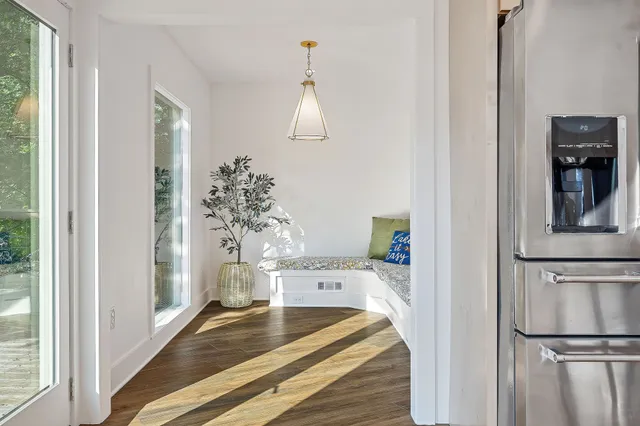 wooden floor in an empty room with a window