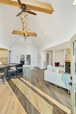 a view of a room with furniture wooden floor and window