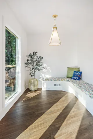 a bathroom with a granite countertop sink a mirror a shower and a bathtub