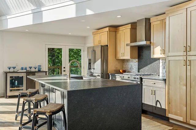 a living room with fireplace furniture and a table