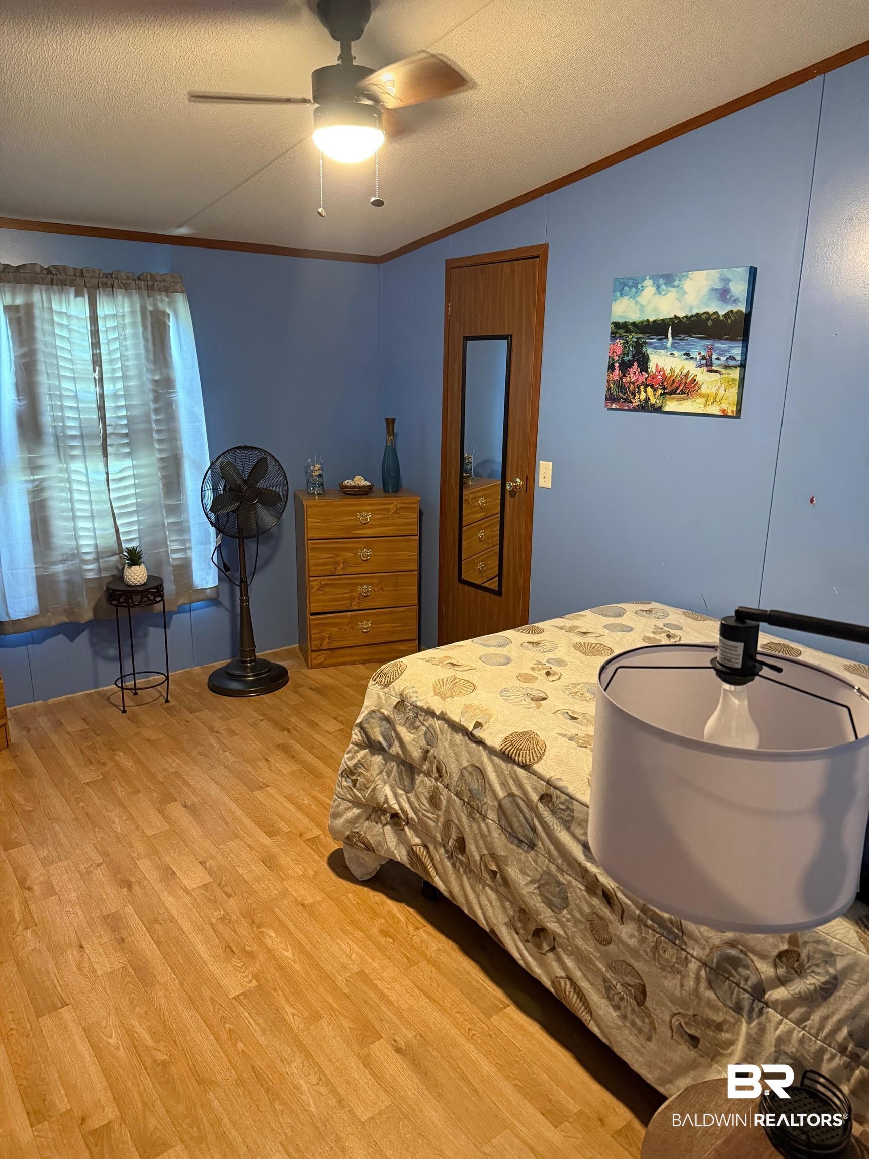15844 County Road 87 Elberta, AL 36530 - Photo 28 of 28 Bedroom featuring ceiling fan, lofted ceiling, ornamental molding, a textured ceiling, and light hardwood / wood-style floors