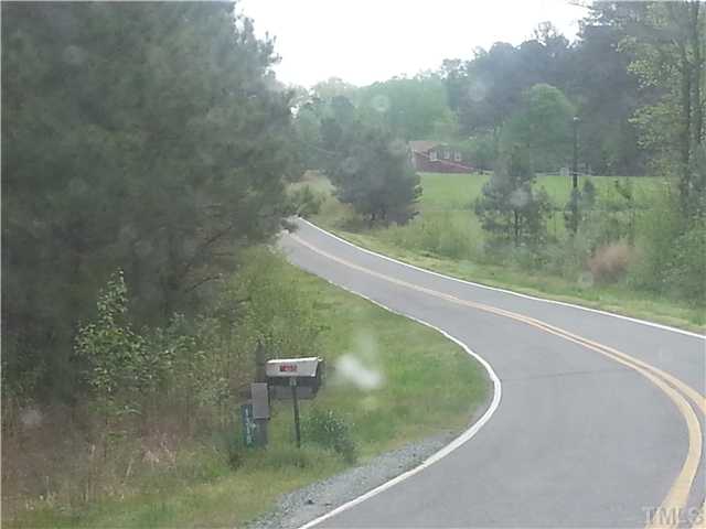 Olives Chapel Road, Unit D Apex, NC 27502 - Photo 6 of 10 ANOTHER VIEW OF SCENIC OLIVES CHAPEL ROAD WHICH IS UNIQUELY CURVY.NICE 15 ACRE PARCEL IS DIRECTLY ACROSS FROM BRICK HOME IN PICTURE.