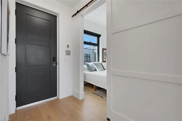 a view of bedroom with furniture and closet