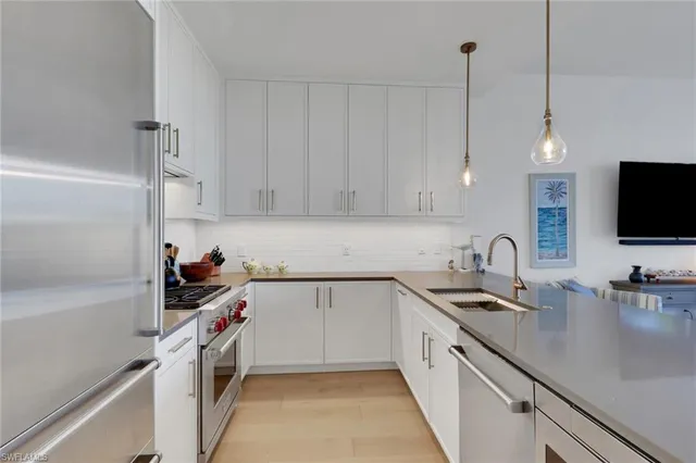 a kitchen with a sink and cabinets