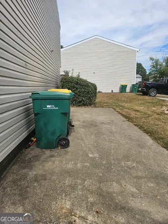 a view of a couches in backyard of house