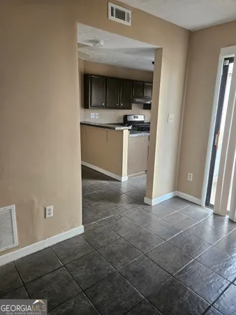 a view of a kitchen from the hallway