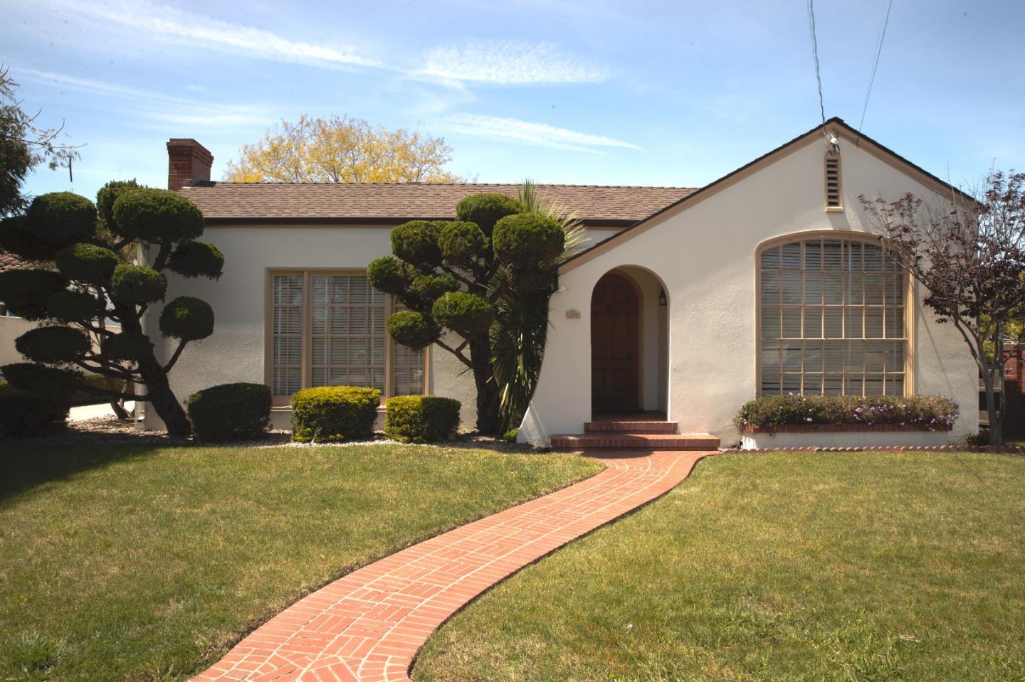 160 Lorimer Street Salinas, CA 93901 - Photo 1 of 13 a front view of a house with a yard