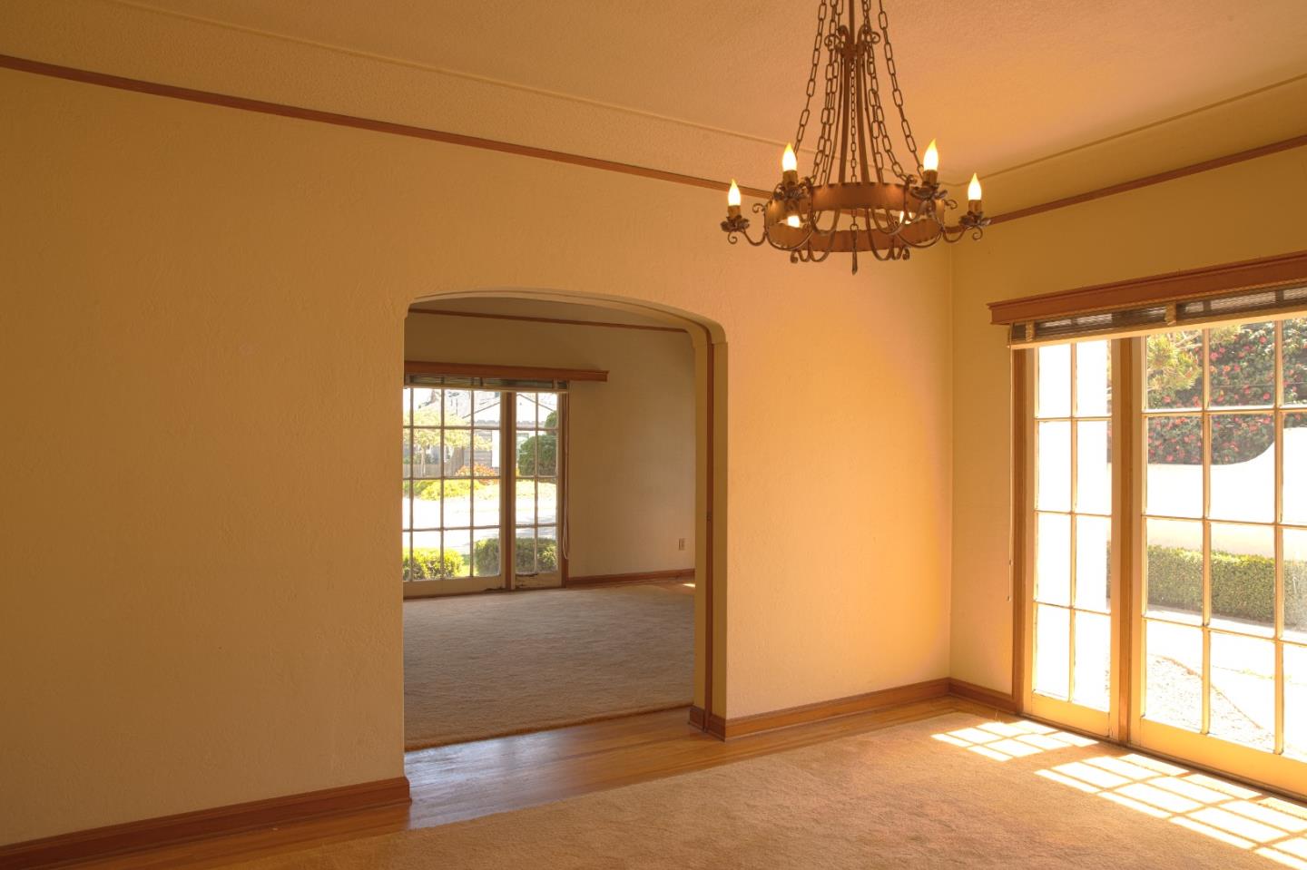 160 Lorimer Street Salinas, CA 93901 - Photo 3 of 13 an empty room with wooden floor and windows