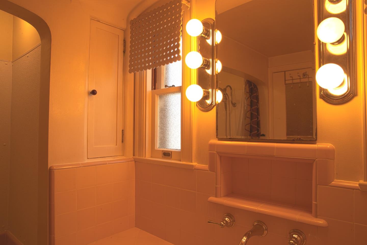 160 Lorimer Street Salinas, CA 93901 - Photo 10 of 13 a bathroom with a mirror and a shower