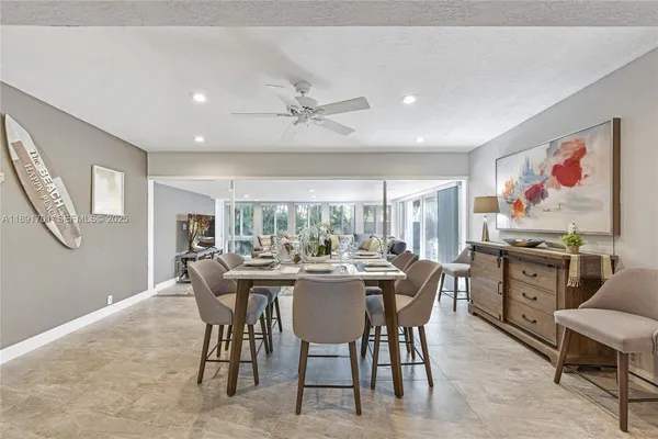 a view of a dining room with furniture window and outside view