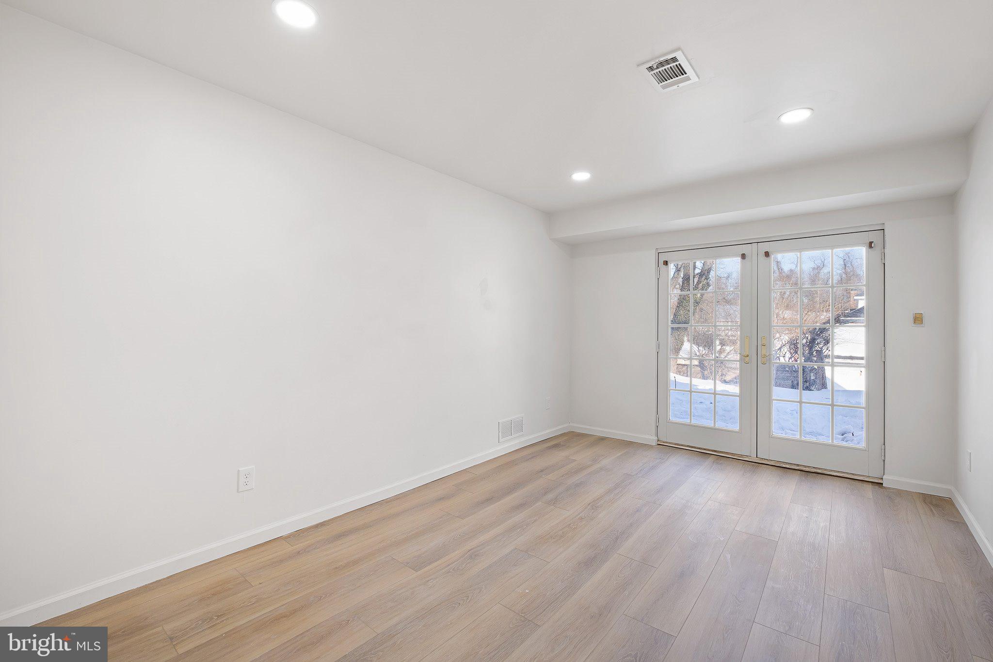 255 Prospect Avenue, Unit B Downingtown, PA 19335 - Photo 12 of 20 wooden floor in an empty room with a window