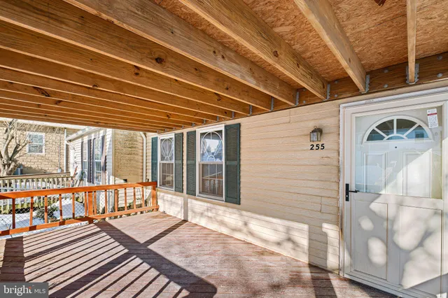 a view of a balcony with wooden floor