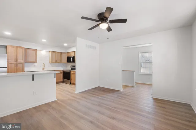 a view of kitchen with wooden floor and window