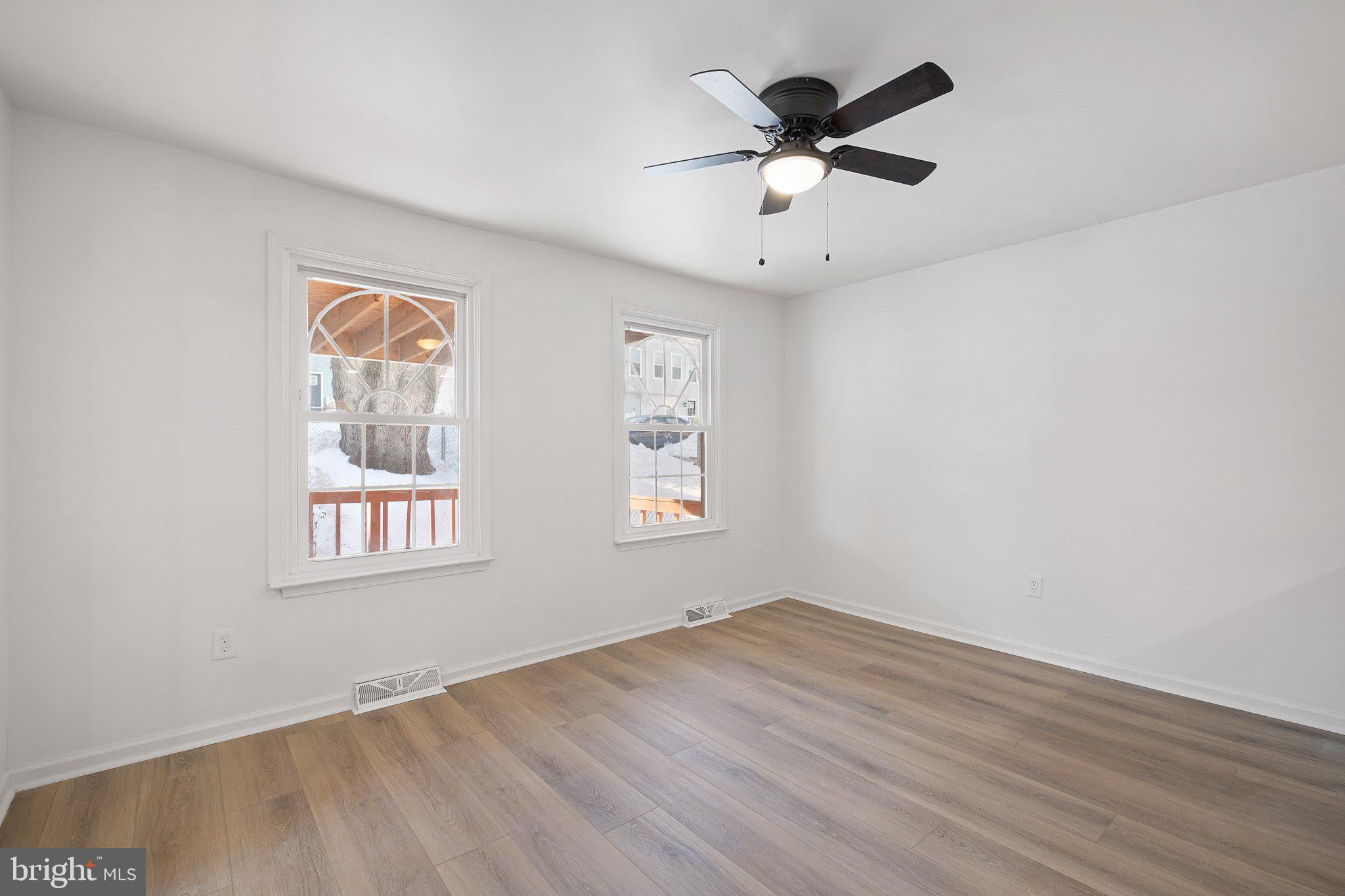 255 Prospect Avenue, Unit B Downingtown, PA 19335 - Photo 8 of 20 wooden floor in an empty room with a window
