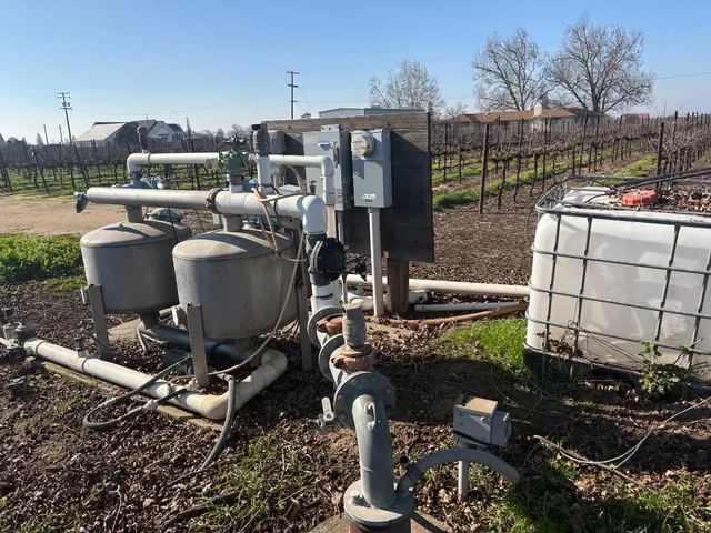 a view of a patio with table and chairs potted plants